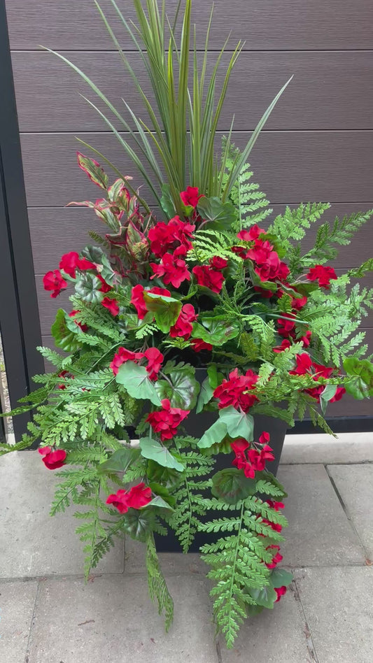 Outdoor Arrangement – Geranium, fern, and variegated foliage